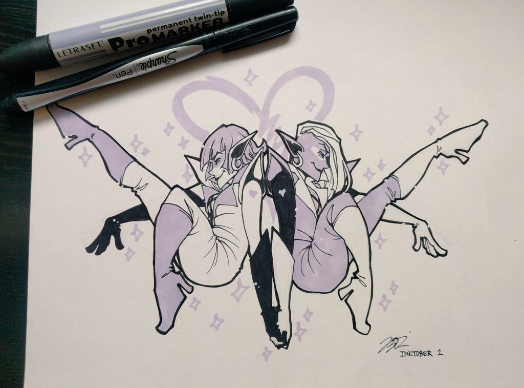 The Wonderland Twins pose back to back and holding hands