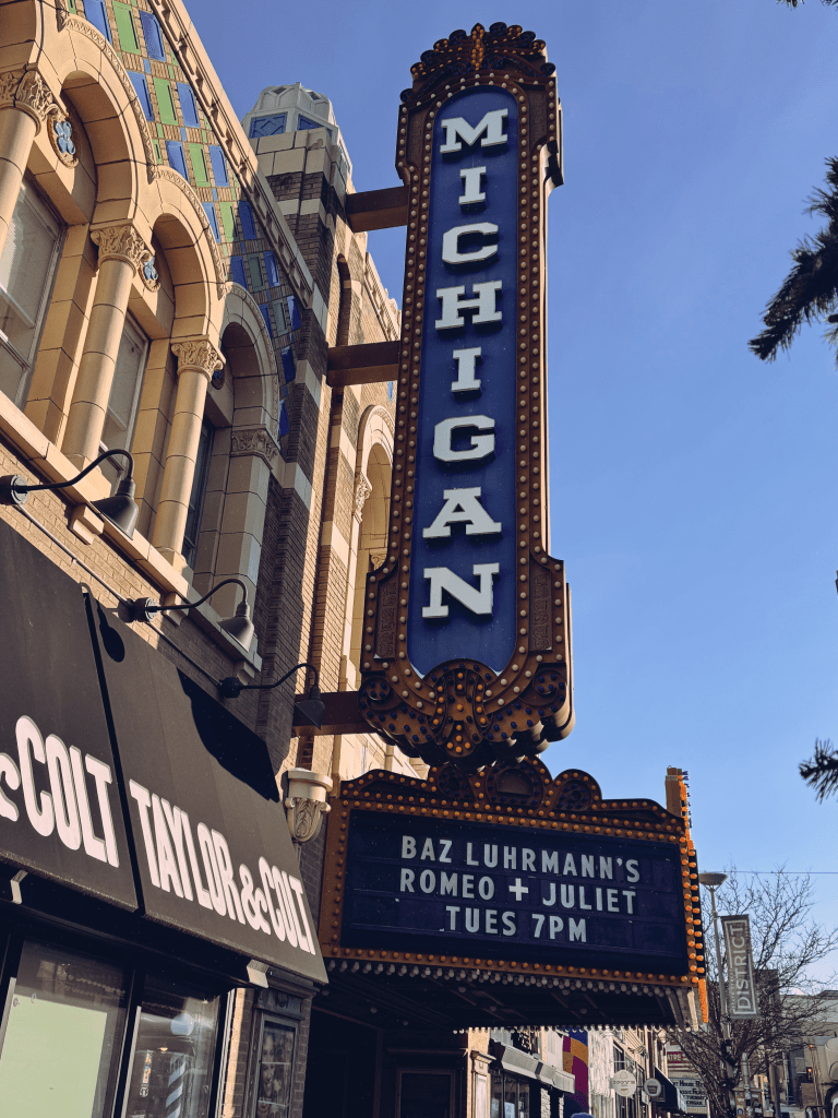 A sign for the Michigan theater that shows they are playing Baz Luhrmann's Romeo + Juliet